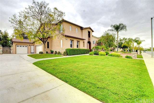 8546 Millpond Place Riverside, CA 92508 - Photo 43 of 60 a front view of house with yard and green space