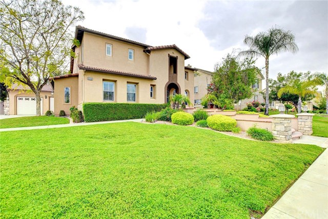 8546 Millpond Place Riverside, CA 92508 - Photo 44 of 60 a front view of house with yard and green space