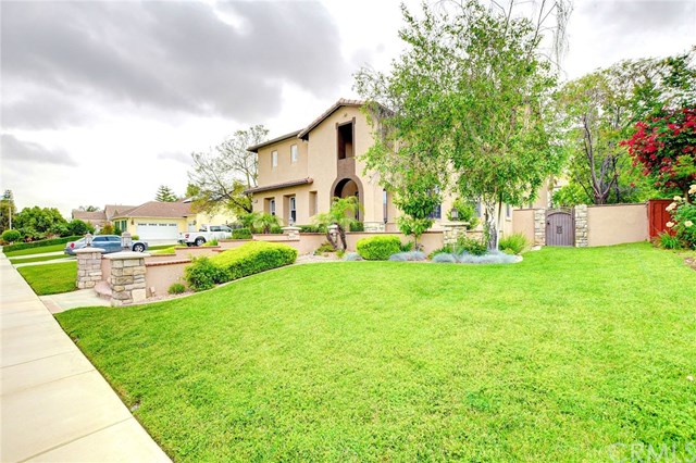 8546 Millpond Place Riverside, CA 92508 - Photo 52 of 60 a front view of a house with garden and trees
