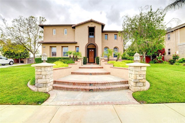 8546 Millpond Place Riverside, CA 92508 - Photo 53 of 60 a view of a white house with a yard