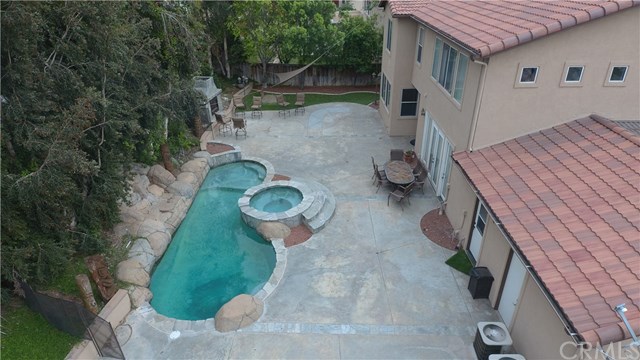 8546 Millpond Place Riverside, CA 92508 - Photo 58 of 60 a backyard of a house with table and chairs