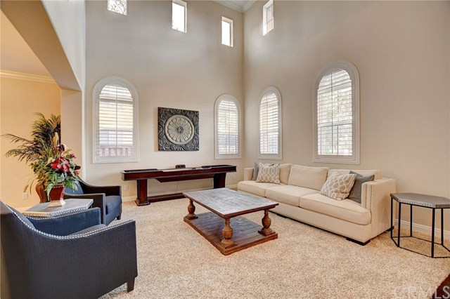 8546 Millpond Place Riverside, CA 92508 - Photo 7 of 60 a living room with furniture and a large mirror