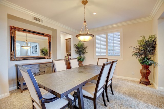 8546 Millpond Place Riverside, CA 92508 - Photo 8 of 60 a dining room with furniture and window