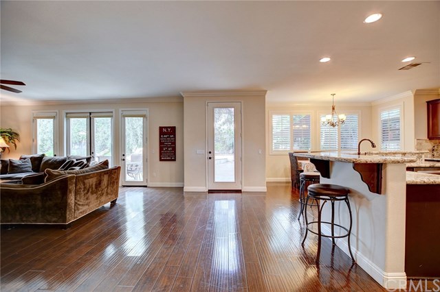 8546 Millpond Place Riverside, CA 92508 - Photo 10 of 60 a view of a a dining room with furniture window and wooden floor