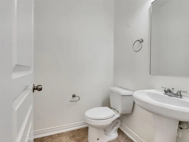 a view of a porch with a table and chairs