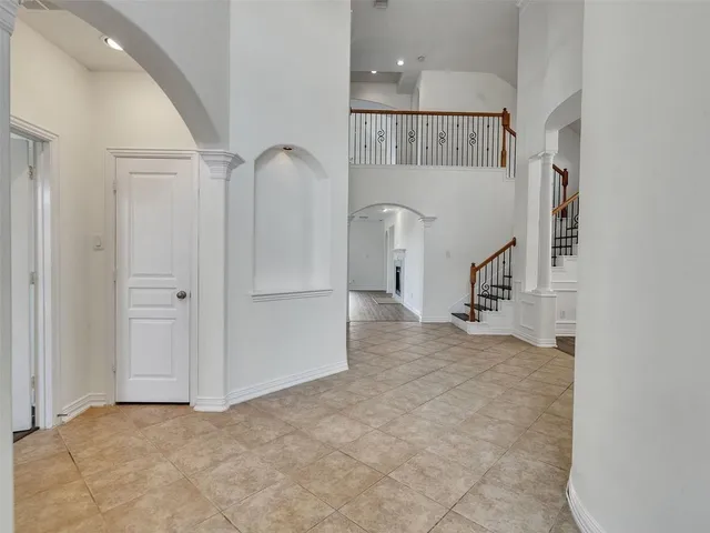a view of a hallway with staircase