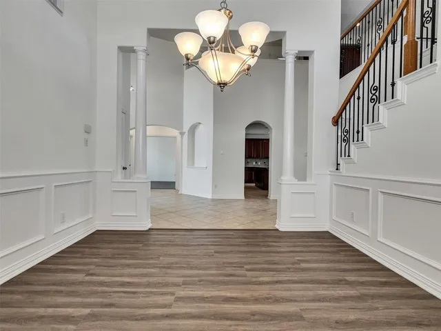 a view of an entryway with wooden floor