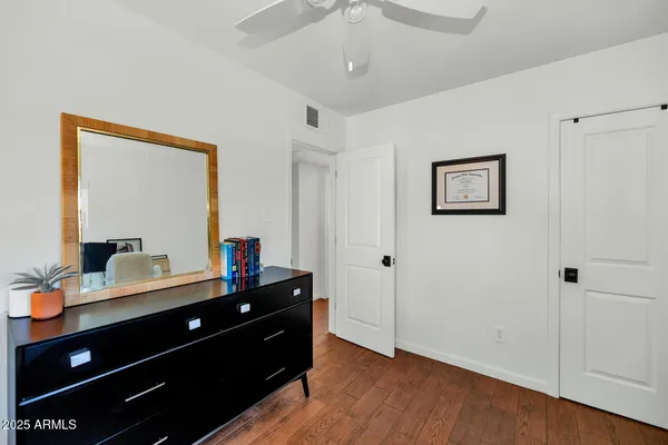 a room with a dresser and a mirror