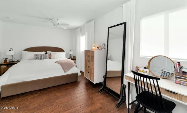 a bedroom with bed and a dresser