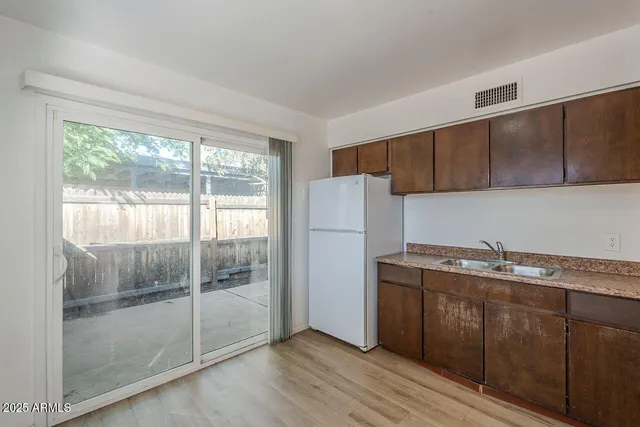 a kitchen with a sink and cabinets