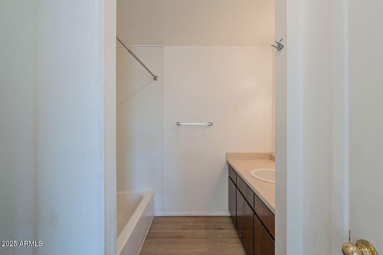 2608 West Ocotillo Road Phoenix, AZ 85017 - Photo 27 of 56 a bathroom with a granite countertop sink