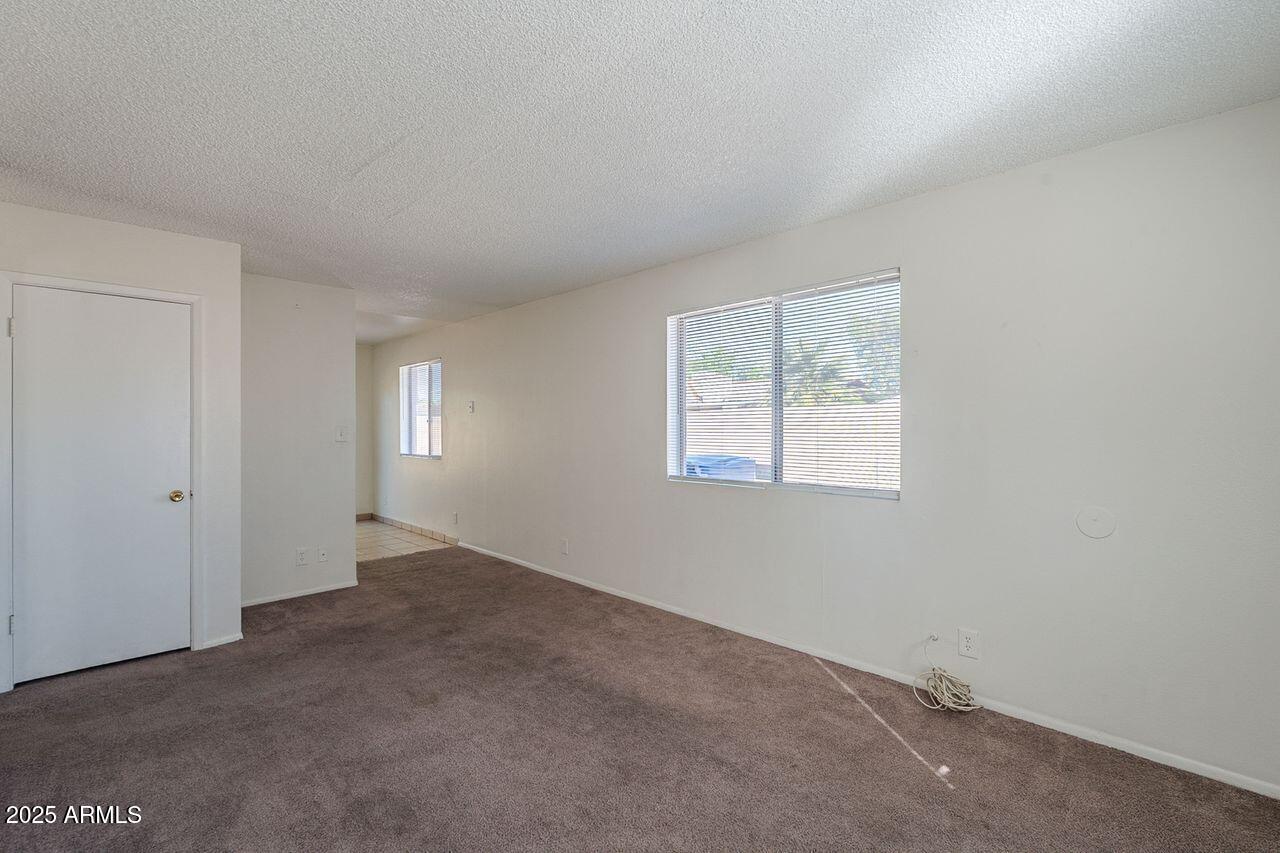 2608 West Ocotillo Road Phoenix, AZ 85017 - Photo 31 of 56 an empty room with windows