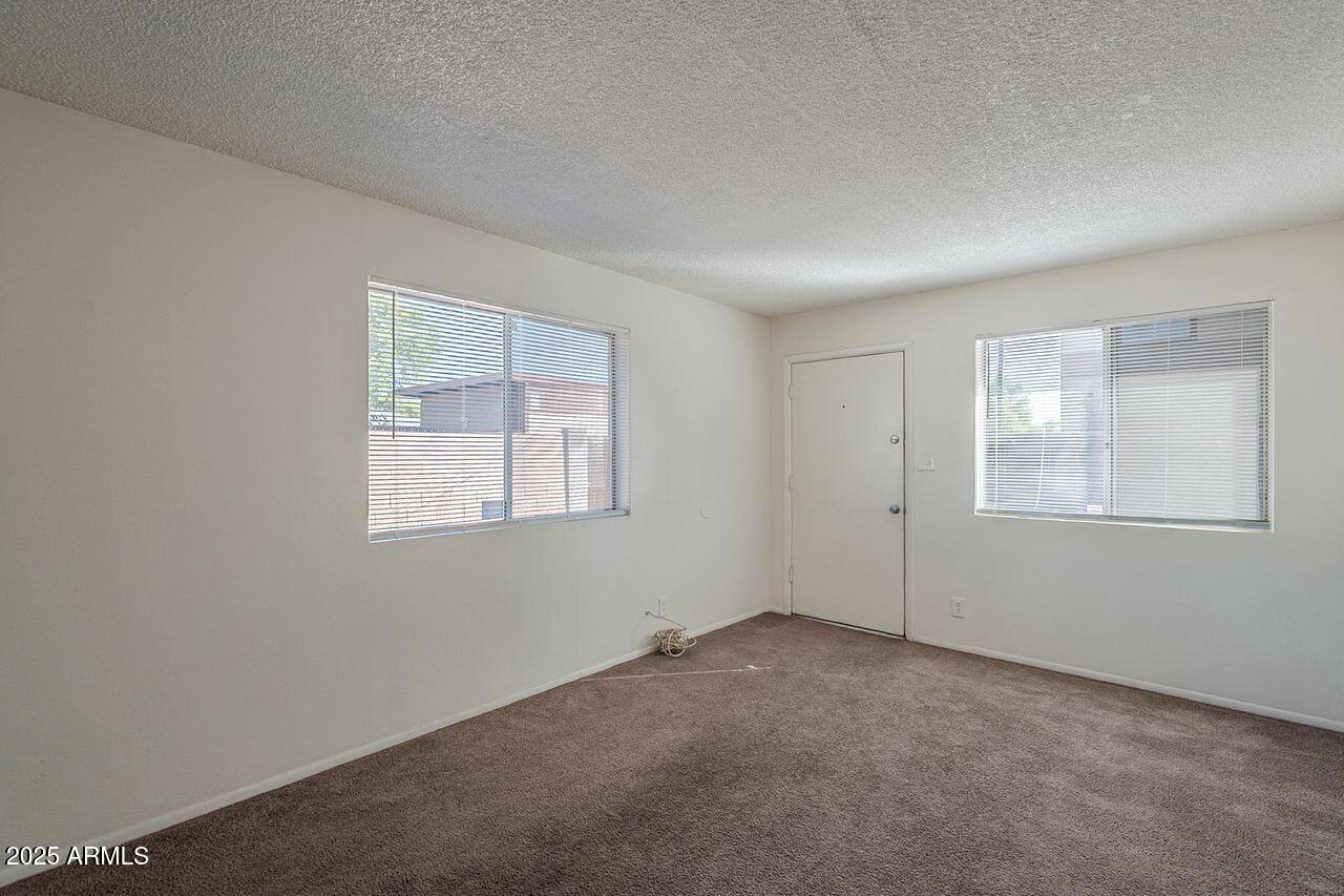 2608 West Ocotillo Road Phoenix, AZ 85017 - Photo 32 of 56 an empty room with windows