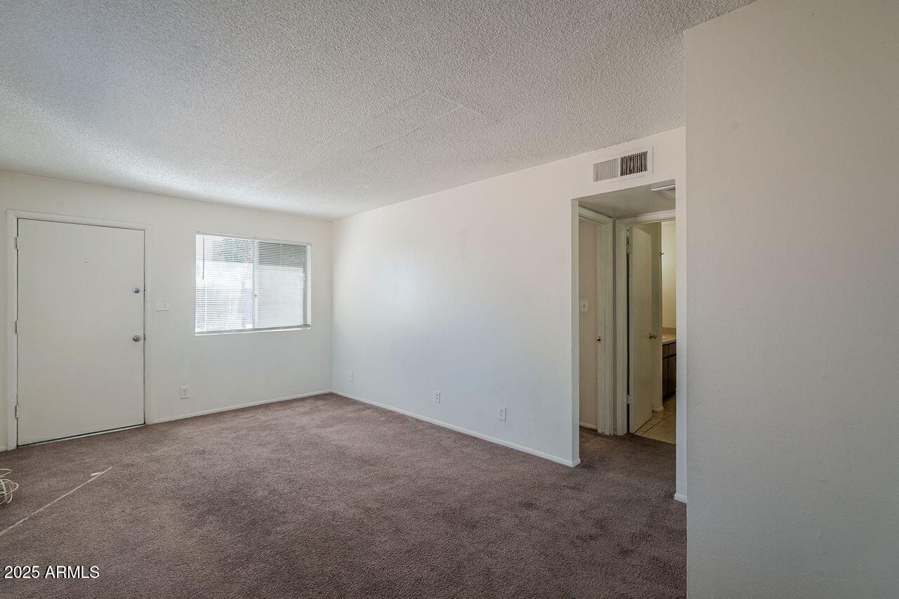 2608 West Ocotillo Road Phoenix, AZ 85017 - Photo 33 of 56 a view of an empty room with a window