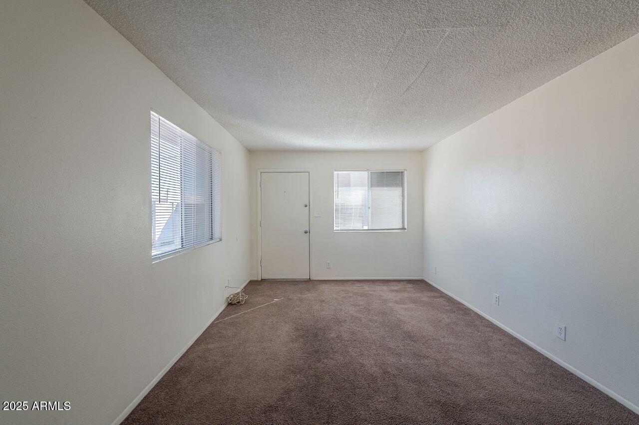 2608 West Ocotillo Road Phoenix, AZ 85017 - Photo 34 of 56 an empty room with windows