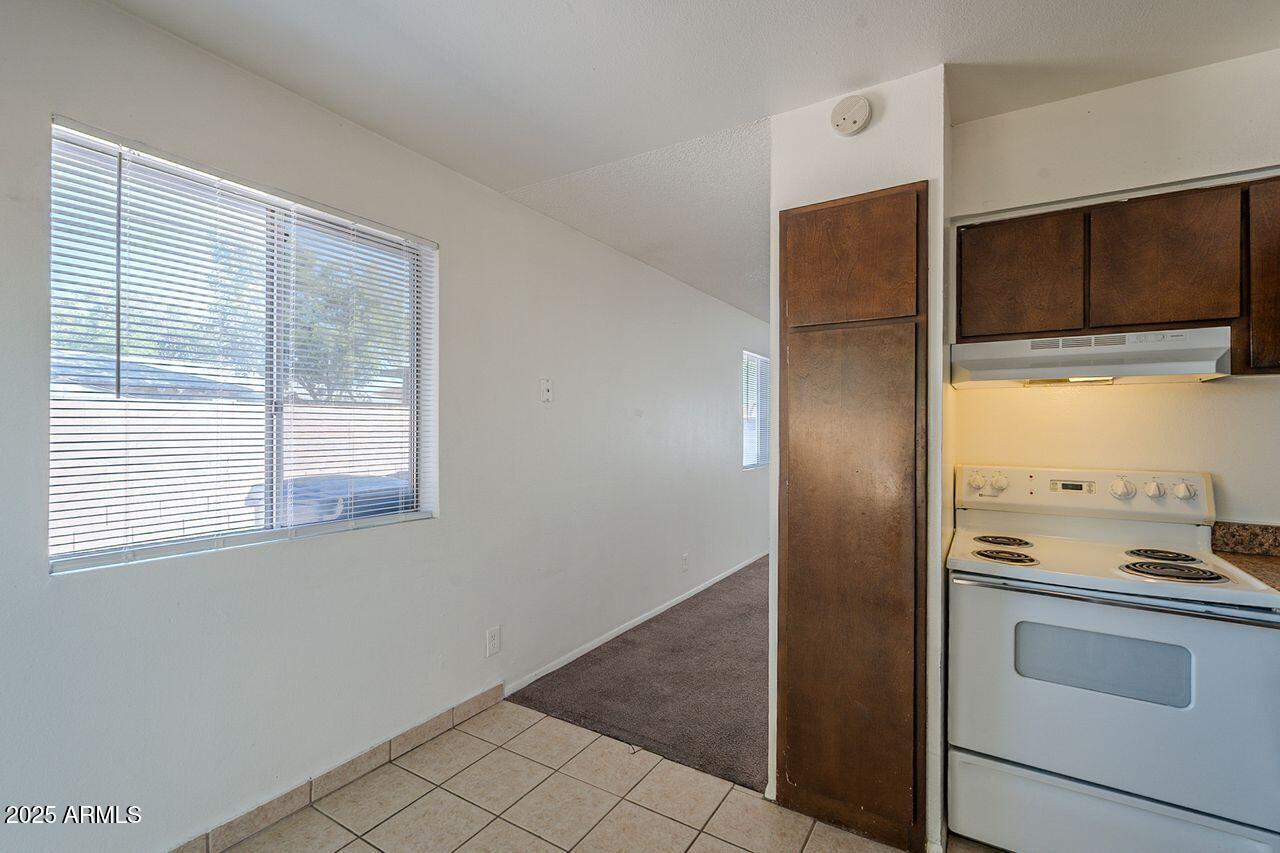 2608 West Ocotillo Road Phoenix, AZ 85017 - Photo 36 of 56 a kitchen with a refrigerator and a stove