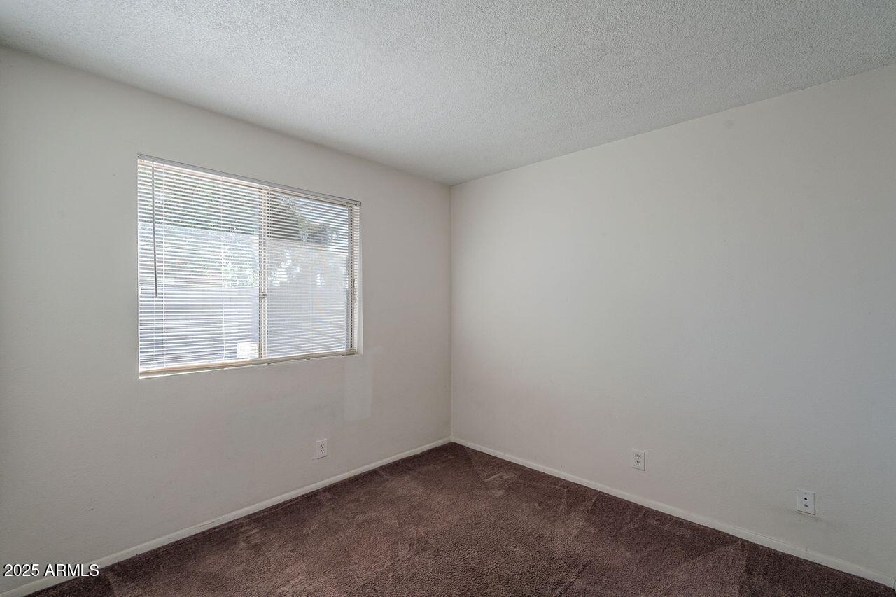2608 West Ocotillo Road Phoenix, AZ 85017 - Photo 41 of 56 an empty room with a window