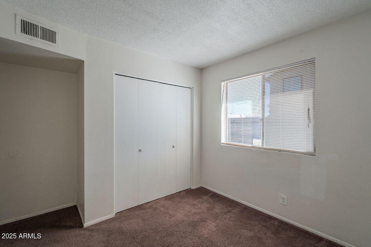 2608 West Ocotillo Road Phoenix, AZ 85017 - Photo 43 of 56 a view of an empty room with a window