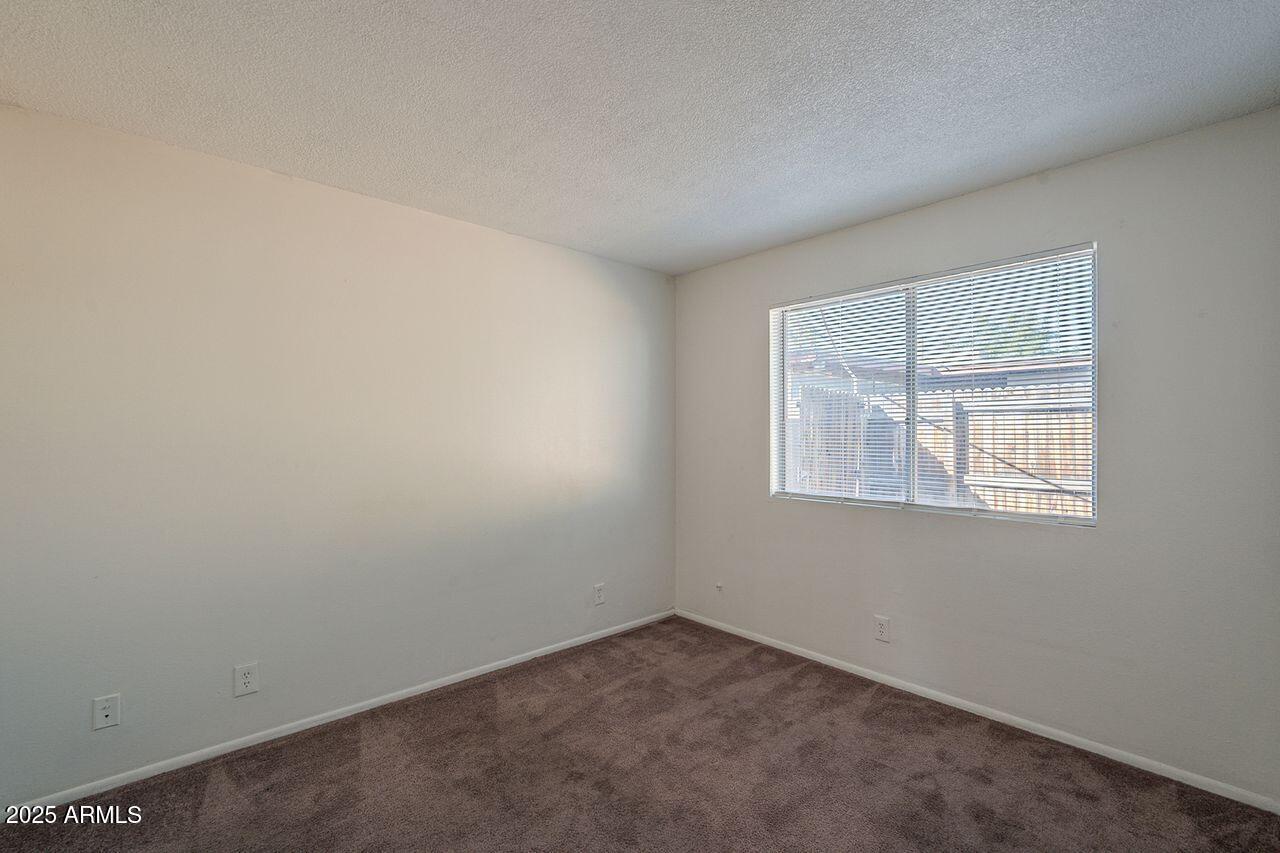 2608 West Ocotillo Road Phoenix, AZ 85017 - Photo 44 of 56 an empty room with a window