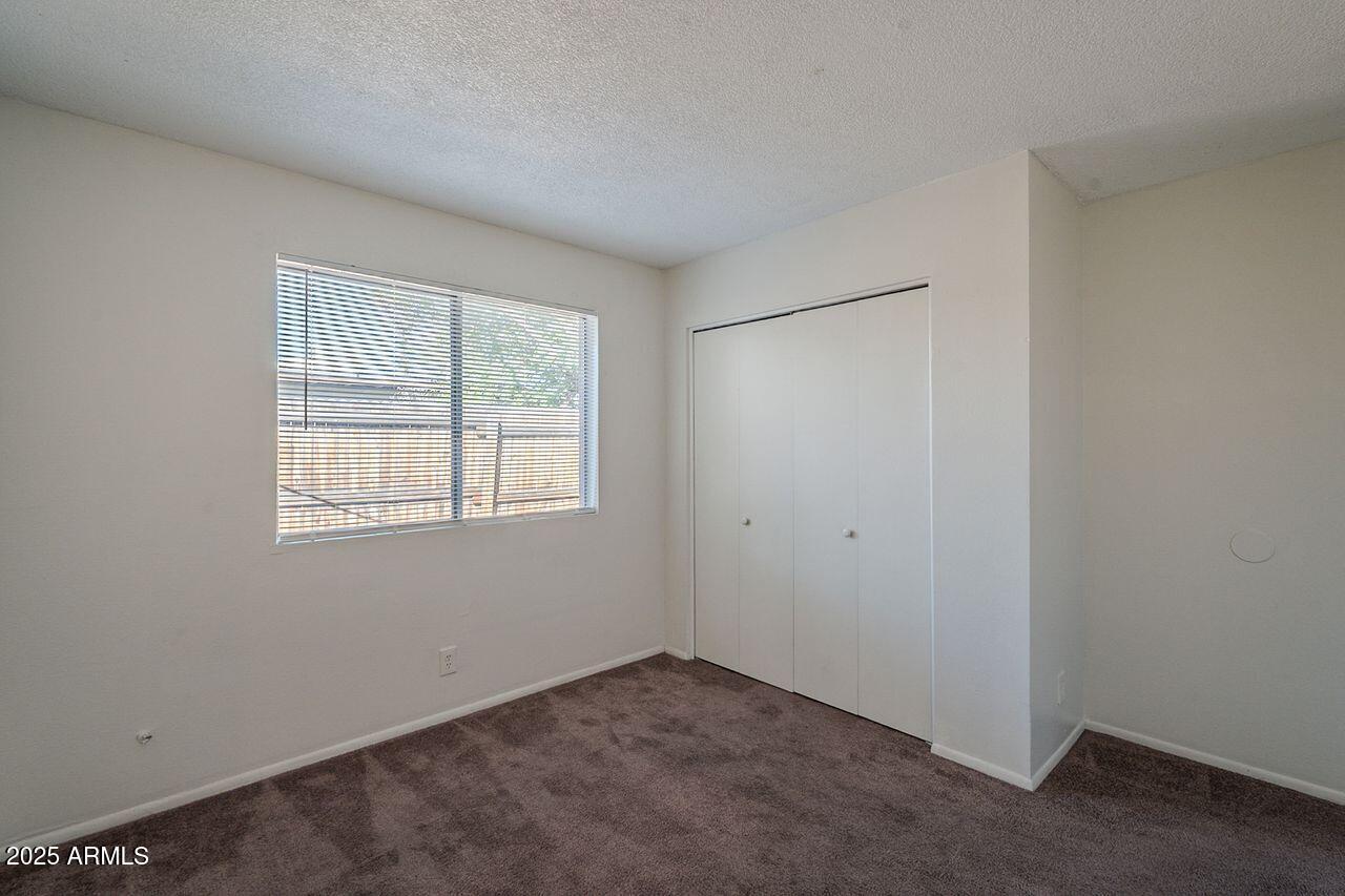 2608 West Ocotillo Road Phoenix, AZ 85017 - Photo 46 of 56 an empty room with a window