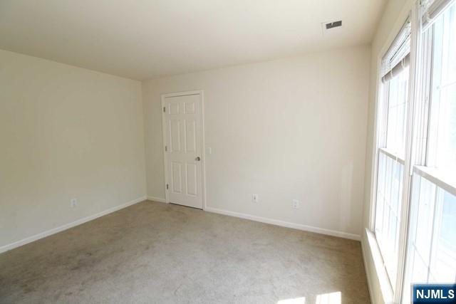 46 Pine Lake Terrace, Unit T046 Westwood, NJ 07675 - Photo 12 of 17 a view of an empty room and a window