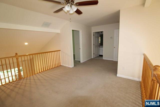 46 Pine Lake Terrace, Unit T046 Westwood, NJ 07675 - Photo 14 of 17 a view of a hallway with a ceiling fan
