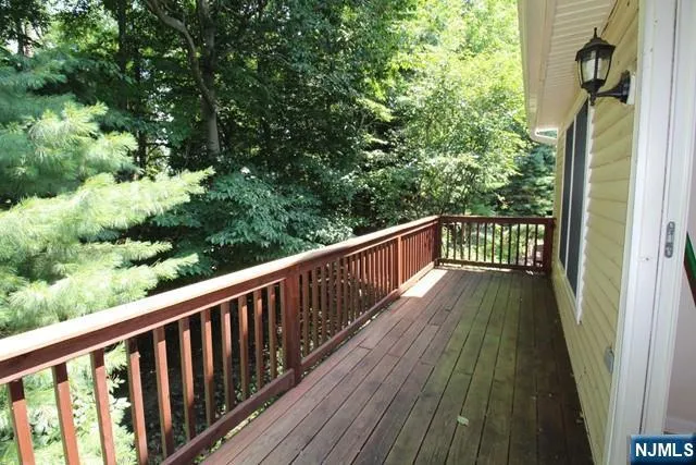a view of balcony with wooden floor