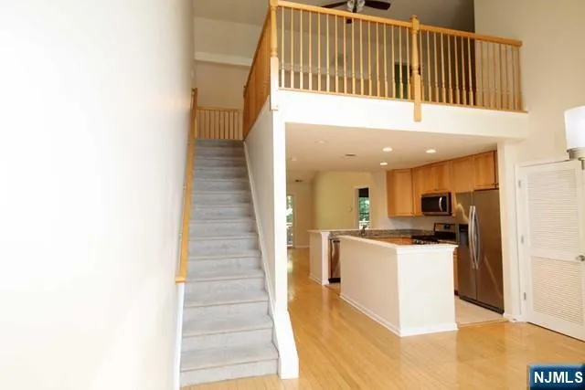 a kitchen with a sink and a refrigerator
