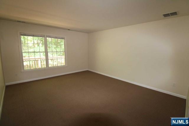 46 Pine Lake Terrace, Unit T046 Westwood, NJ 07675 - Photo 10 of 17 an empty room with a window
