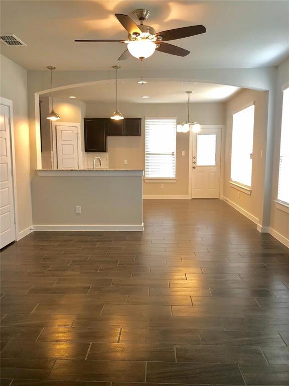 1003 Sierra Vista Court, Unit 2 Midlothian, TX 76065 - Photo 2 of 9 a view of an empty room with kitchen and window