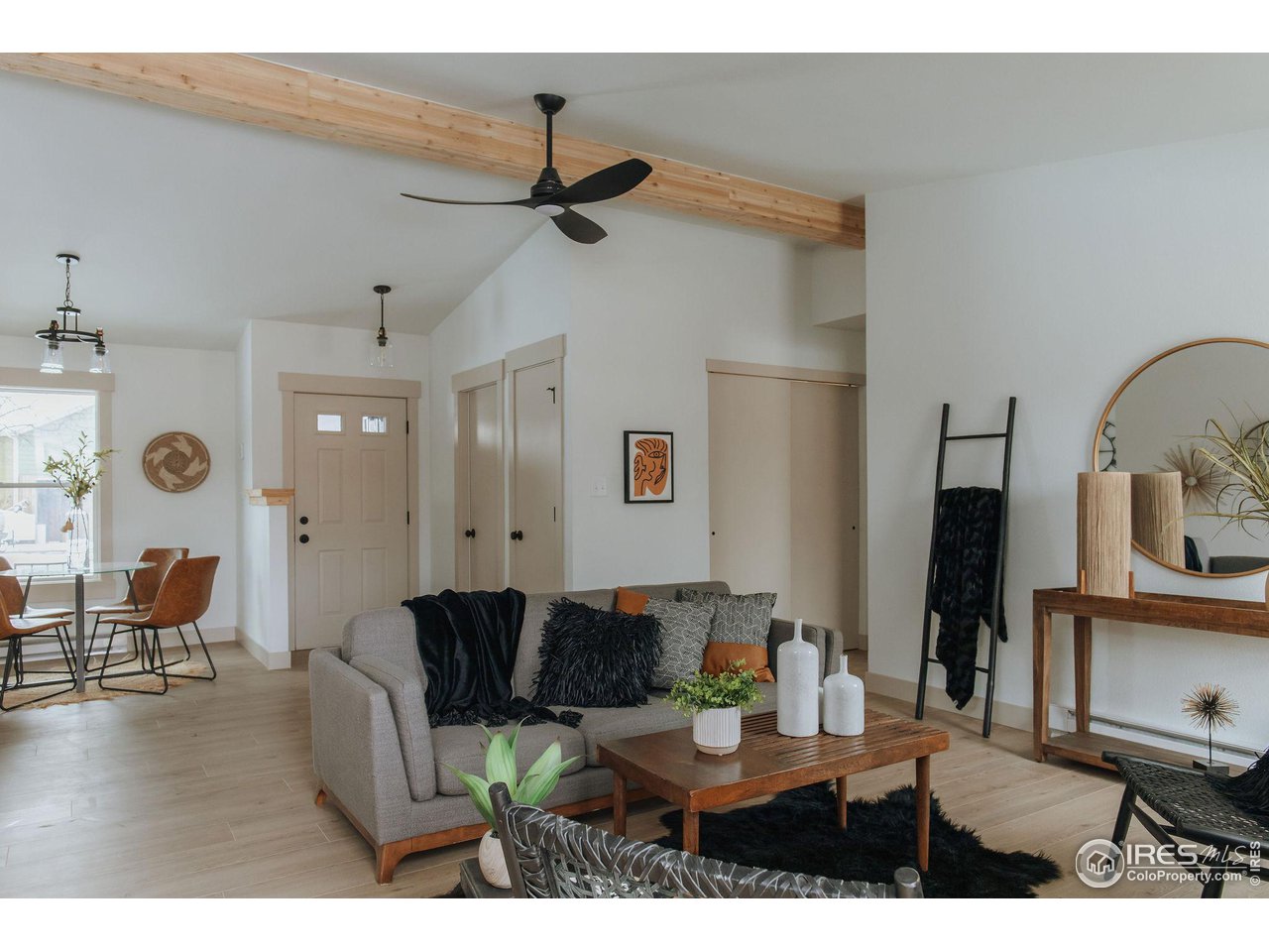 648 Justice Drive Fort Collins, CO 80526 - Photo 6 of 32 a living room with furniture and a chandelier