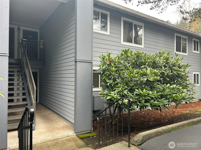 a view of a house with a tree