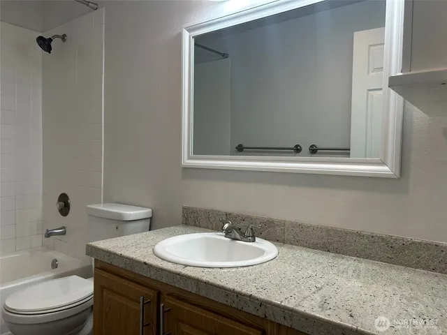 a view of a big yard with a small yard and large trees