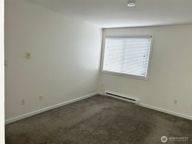 a view of a house with yard and tree s