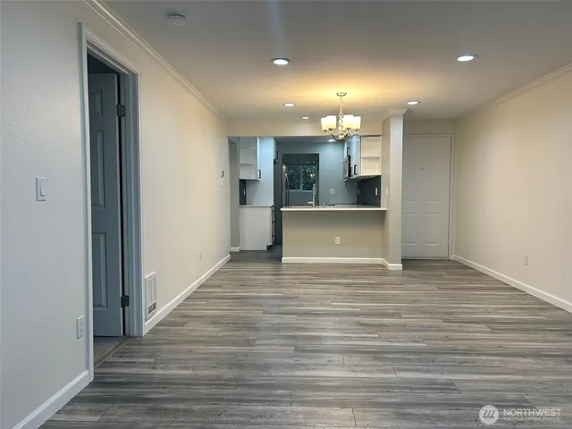 a view of a kitchen from the hallway