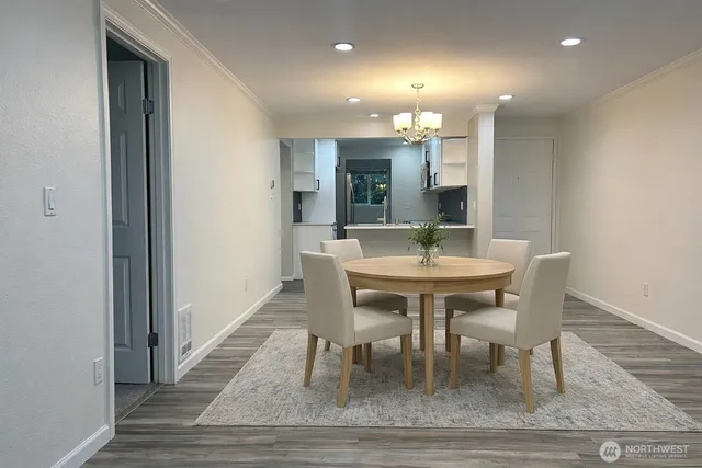 a kitchen with a refrigerator and a sink