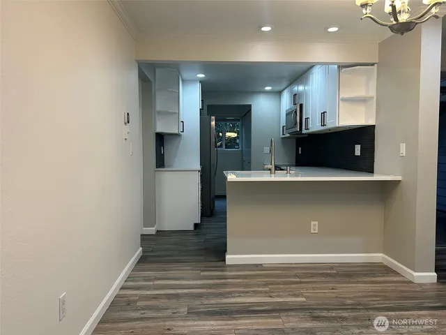 a kitchen with a stove and a microwave