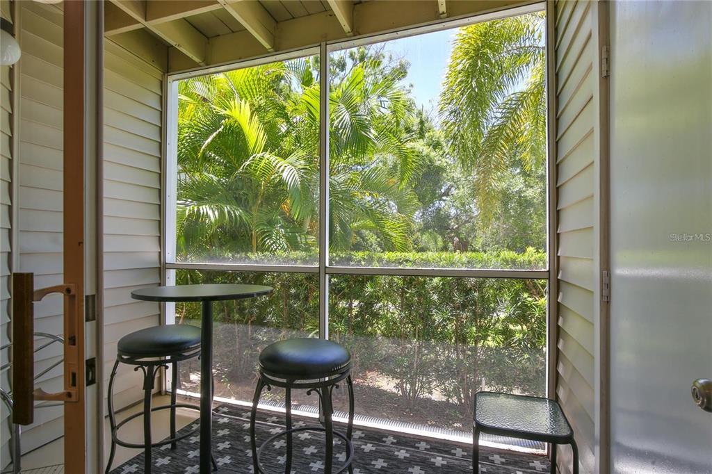 850 South Tamiami Trail, Unit 409 Sarasota, FL 34236 - Photo 11 of 22 a view of a chairs and table in the balcony