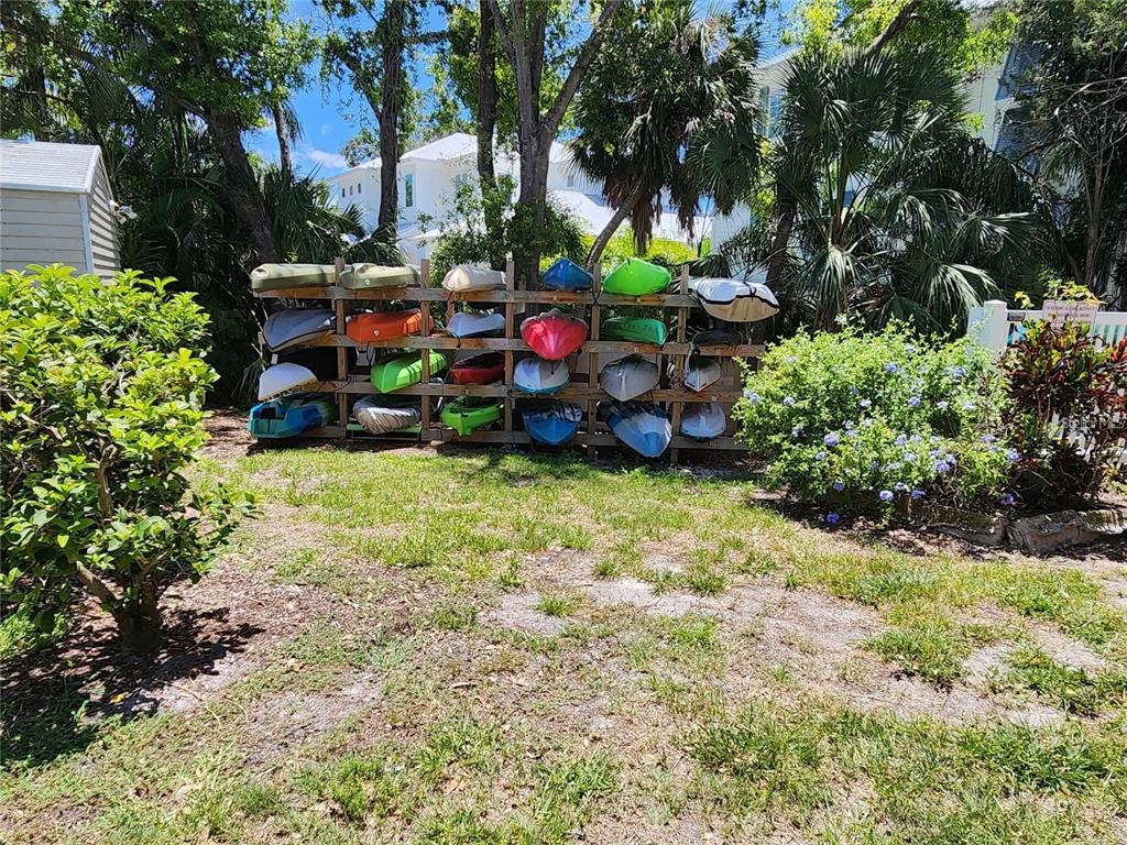 850 South Tamiami Trail, Unit 409 Sarasota, FL 34236 - Photo 17 of 22 a backyard of a house with lots of green space and fountain