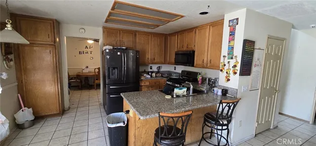 a kitchen with a refrigerator and a refrigerator