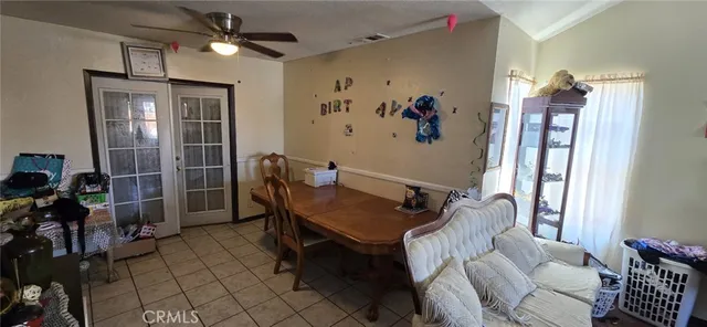 a view of a livingroom with furniture and a window