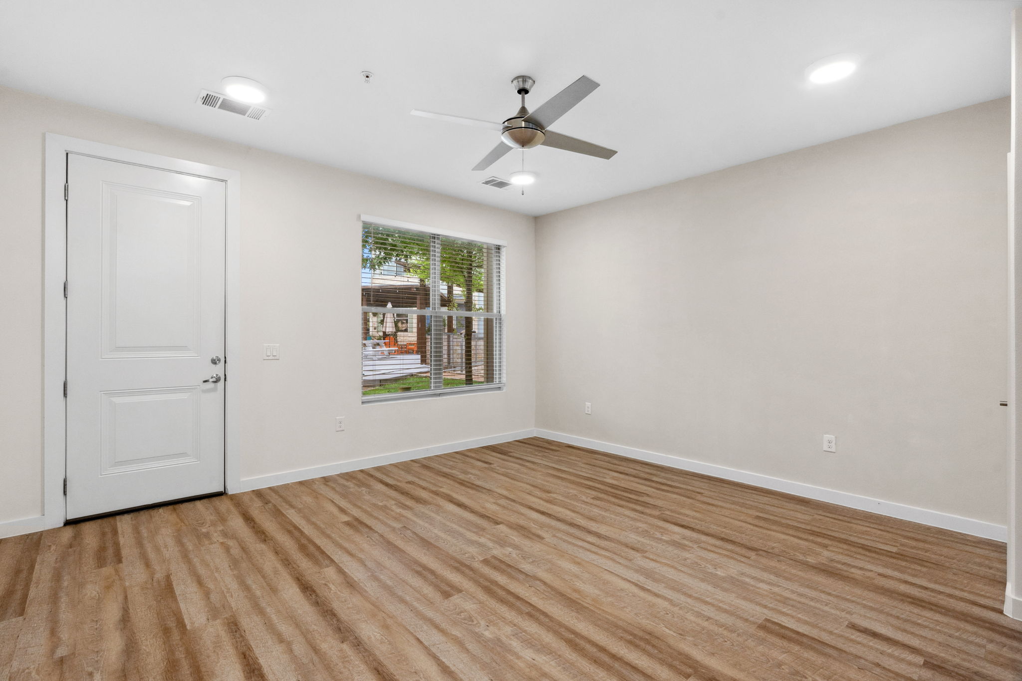 7805 Cooper Lane, Unit 606 Austin, TX 78745 - Photo 13 of 35 wooden floor in an empty room with a window