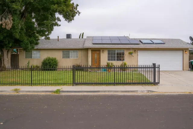 a view of a deck with a yard and plants
