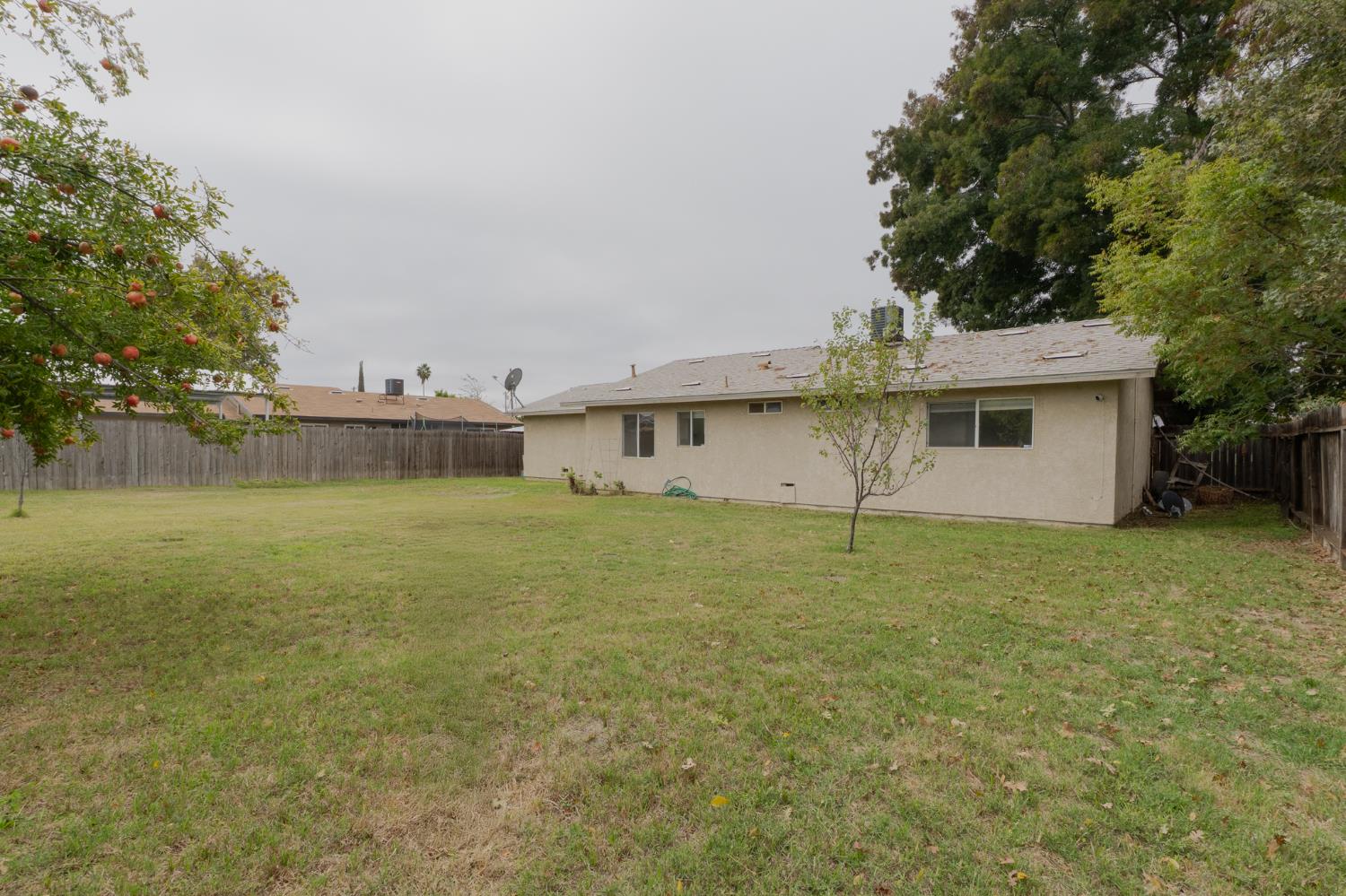 559 Perry Avenue Corcoran, CA 93212 - Photo 11 of 12 a view of a house with a backyard