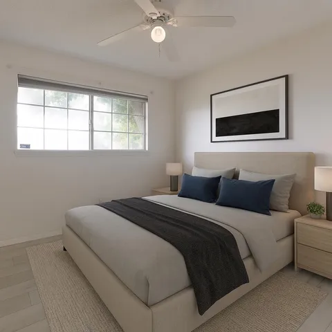 a bedroom with a bed and a window