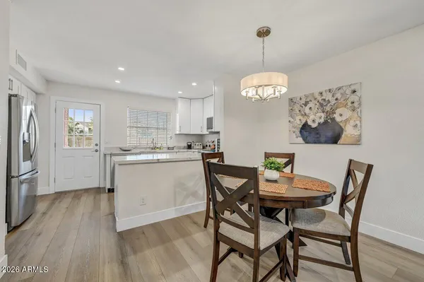a view of a dining room with furniture window and wooden floor