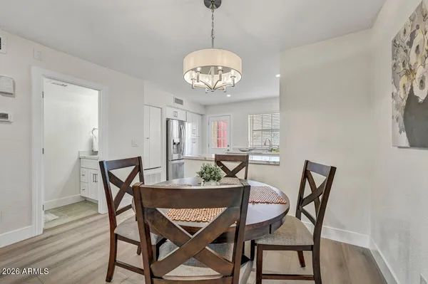 a view of a dining room with furniture and wooden floor