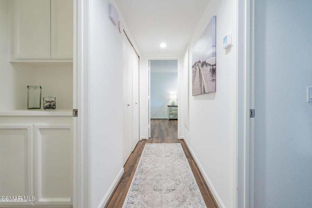 4481 Antigua Way Oxnard, CA 93035 - Photo 18 of 76 a view of a hallway with wooden floor and staircase