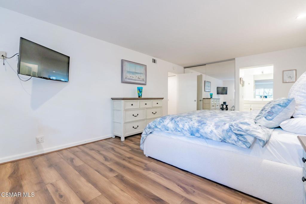 4481 Antigua Way Oxnard, CA 93035 - Photo 22 of 76 a bedroom with a bed and a flat screen tv