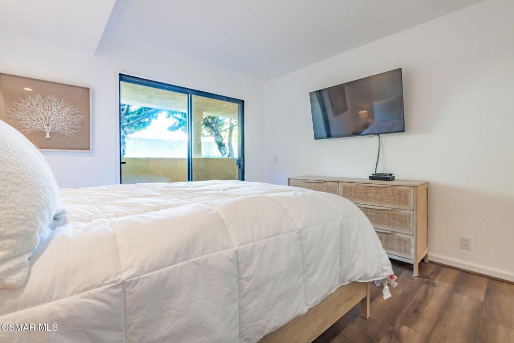 4481 Antigua Way Oxnard, CA 93035 - Photo 31 of 76 a bedroom with a bed and a flat screen tv